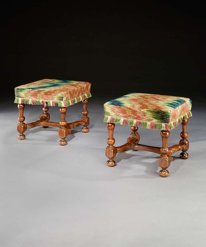 A PAIR OF WILLIAM AND MARY WALNUT STOOLS